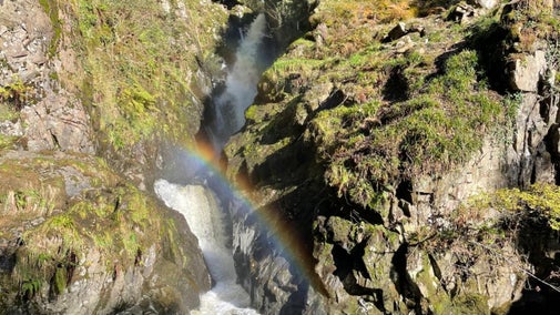 The spray from Aira Force and the spring sunshine creates a rainbow